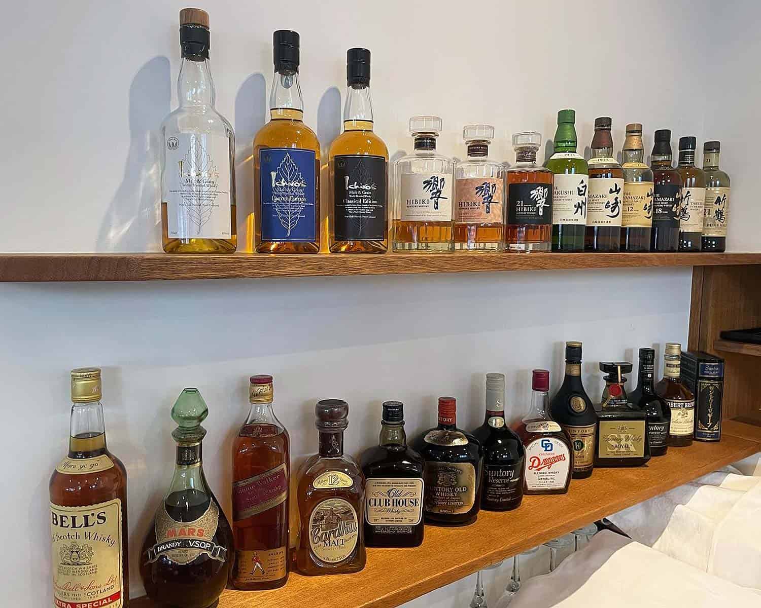 Selection of whiskies including several famous Japanese whiskies such as Yamazaki 12, Yamazaki 18 and Hibiki.