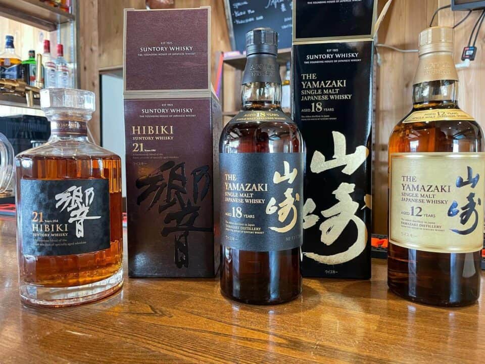 Bottles of whisky, Hibiki 21 years, Yamazaki 18 years and Yamazaki 12 years.